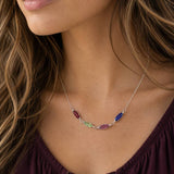 Delicate silver plated necklace with colourful oval birthstone links, styled as a vibrant everyday layering piece.