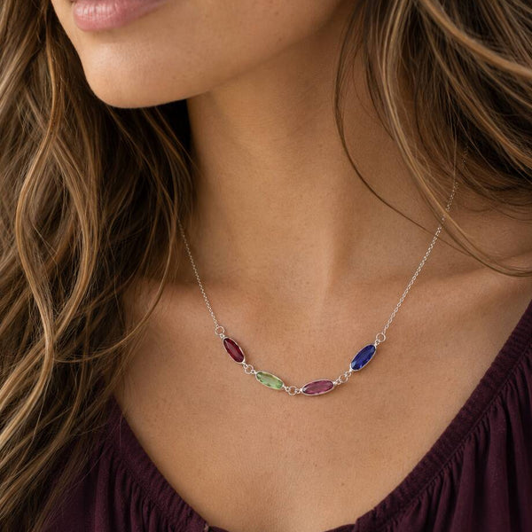 Delicate silver plated necklace with colourful oval birthstone links, styled as a vibrant everyday layering piece.