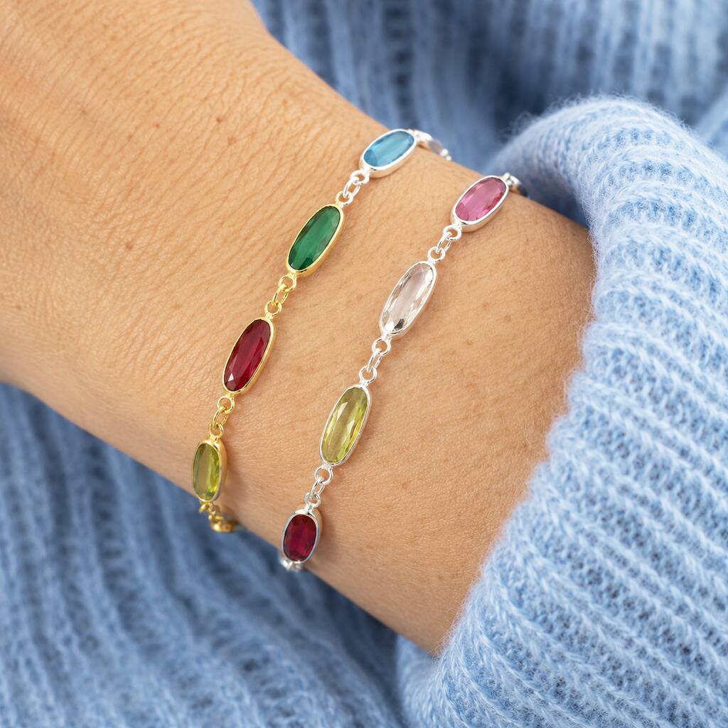 Oval link birthstone bracelets in gold and silver with colourful crystals, timeless jewellery for effortless layering.