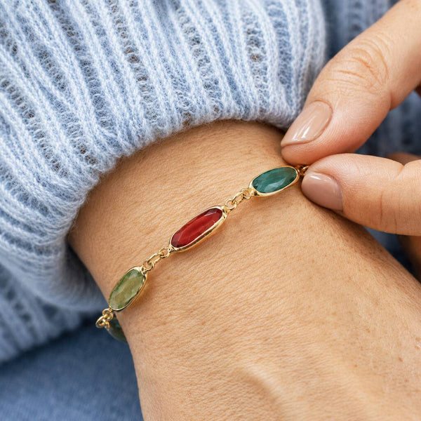 Gold plated oval link birthstone bracelet with colourful crystal links, elegant layering jewellery for everyday style.