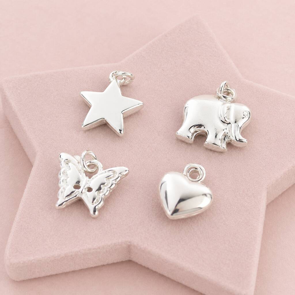 Silver charm collection featuring heart, butterfly, elephant and star charms for custom bracelets