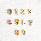 Image shows enamel numbers in the colours available.