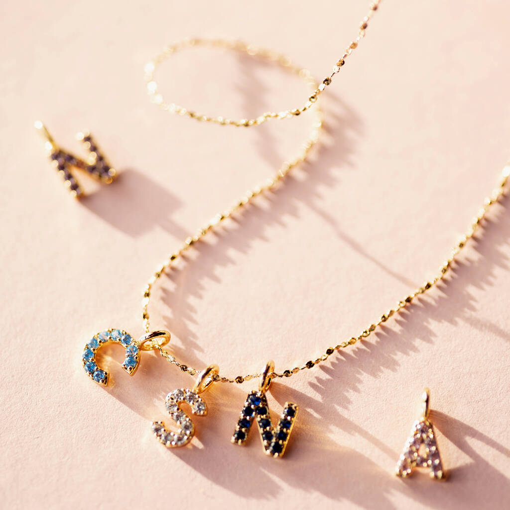 Birthstone initial charm necklace representing family and loved ones