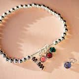 Adjustable beaded Mama bracelet with personalised birthstones, a meaningful gift for mums in silver