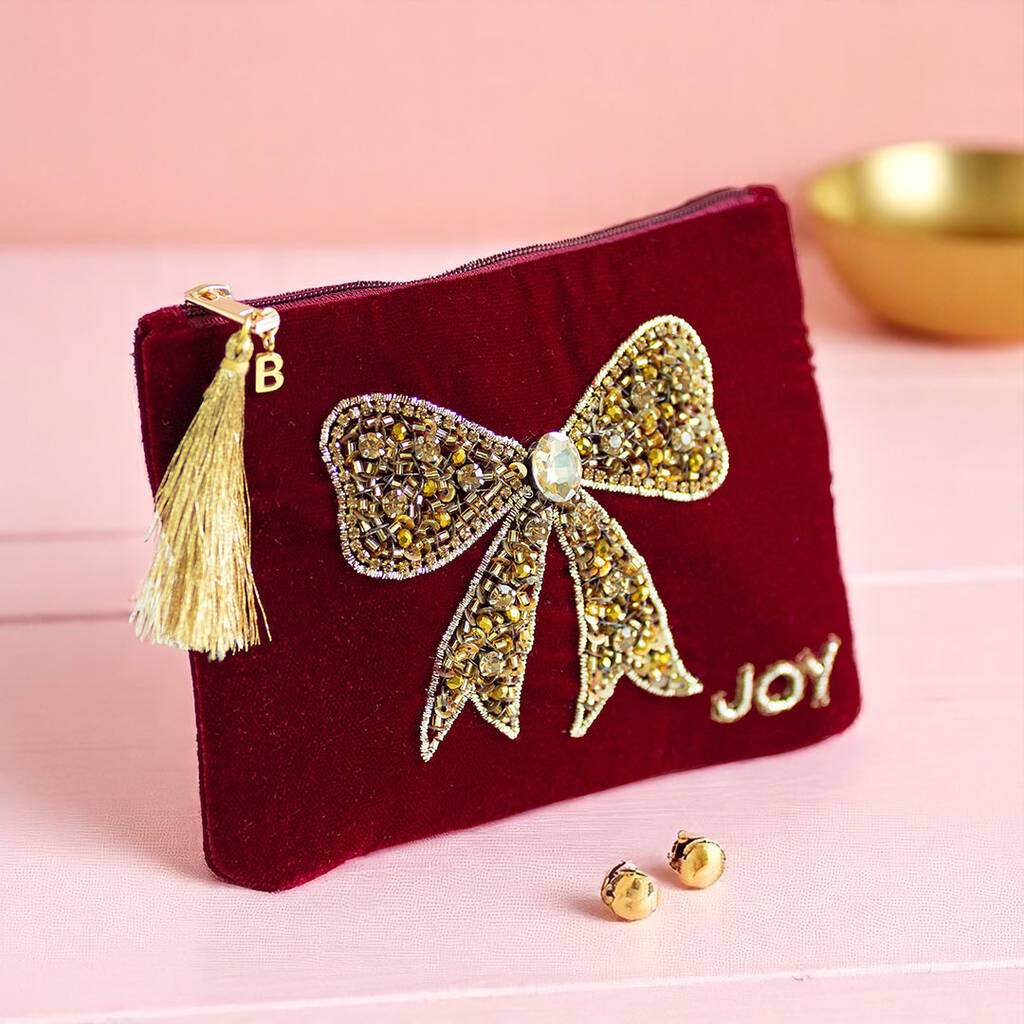 Personalised velvet beaded bow pouch with gold initial charm and tassel