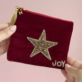 Personalised velvet beaded star pouch with gold initial charm and tassel