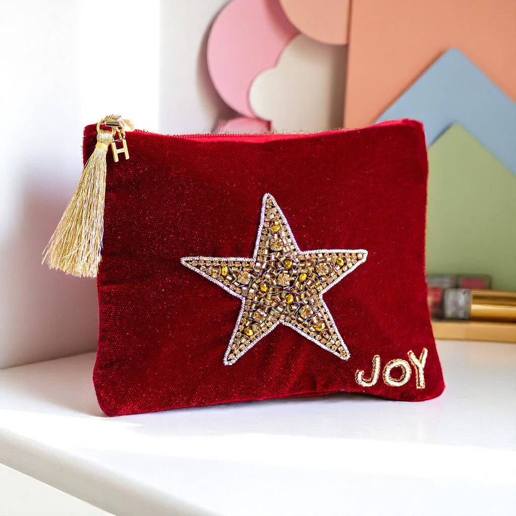 Luxury velvet pouch with hand-beaded star design, crystal detailing and JOY embroidery