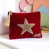 Luxury velvet pouch with hand-beaded star design, crystal detailing and JOY embroidery