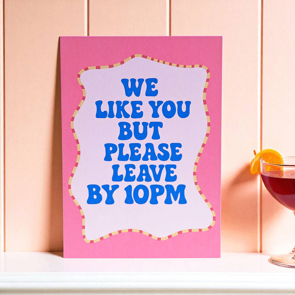 Please Leave By 10pm funny wall print with bold blue typography on pink background