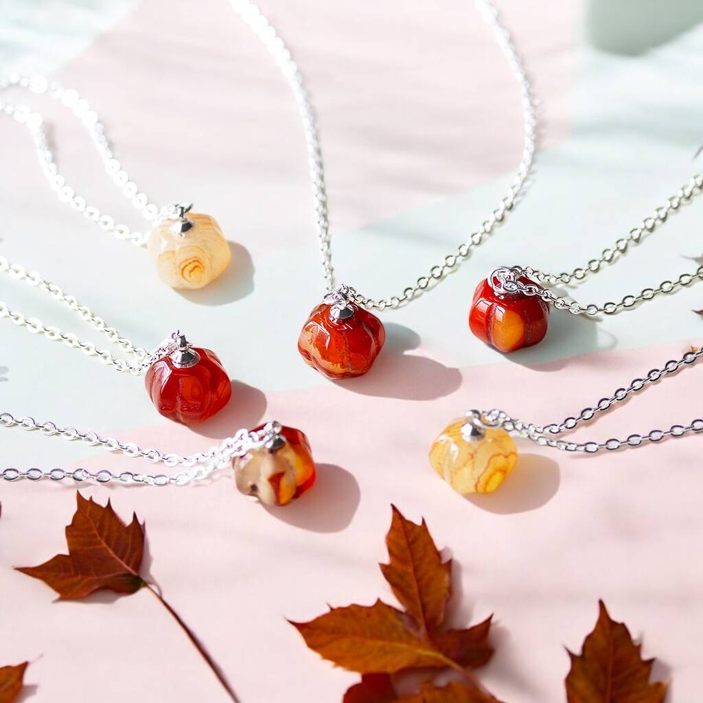 Silver gemstone pumpkin necklaces shown in a variety of shades of red agate.