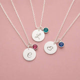 Silver plated initial disc necklaces with colourful birthstone charms, perfect for layering or everyday personalised style