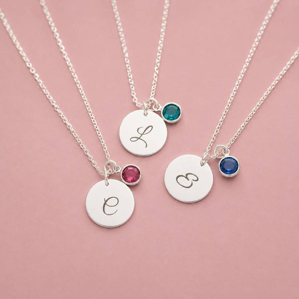 Silver plated initial disc necklaces with colourful birthstone charms, perfect for layering or everyday personalised style