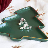 Image shows Silver Plated Triple Hoop Pearl Earrings in a green Christmas tree shaped dish.