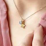 Model wears Star Charm Necklace with Star Birthstone featuring the March birthstone