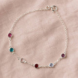 Sterling silver birthstone bracelet with colourful crystal accents, elegant personalised jewellery for layering.