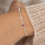 Sterling silver mini birthstone bracelet with colourful crystal details, minimalist jewellery for effortless layering.