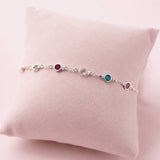 Sterling silver birthstone bracelet with colourful crystal accents, timeless stacking jewellery with a delicate finish.