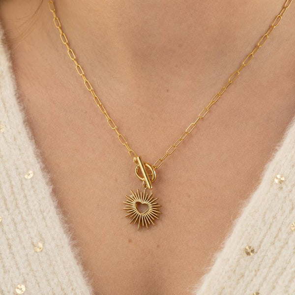 Gold plated sunburst heart T bar necklace with a paperclip chain, stylish everyday jewellery for layering.