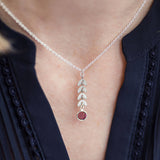 Model wears silver leaf vine necklace with February Amethyst Swarovski birthstone.
