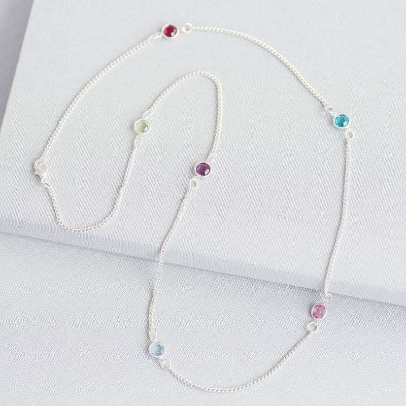 Image shows silver plated long family birthstone necklace with with six Swarovski birthstones