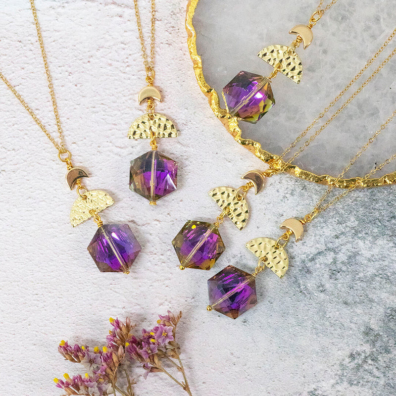 image shows five purple hex crescent duo necklaces with half moon charms on a white background.