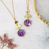 image shows purple hex crescent duo necklaces with half moon charms on a white background.