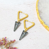 Image shows ero gold plated triangle huggie earrings with swarovski crystal in black.