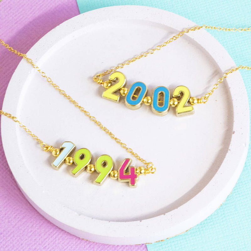 Image shows two personalised enamel significant date necklace