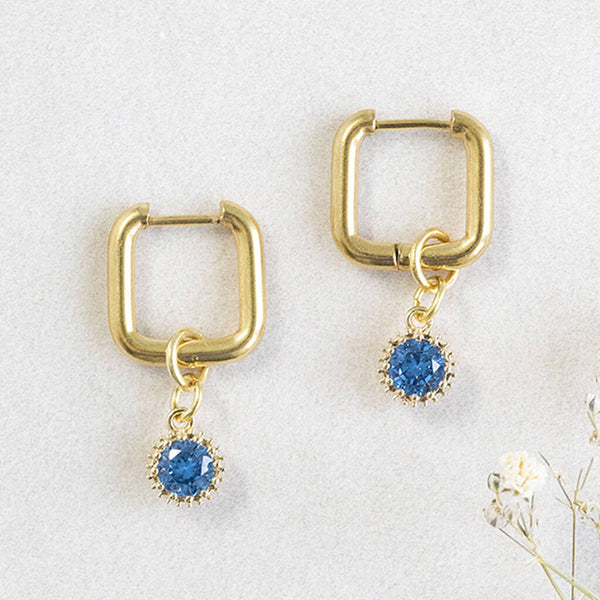 Image shows Square Huggie Earrings With December Birthstone Detail 